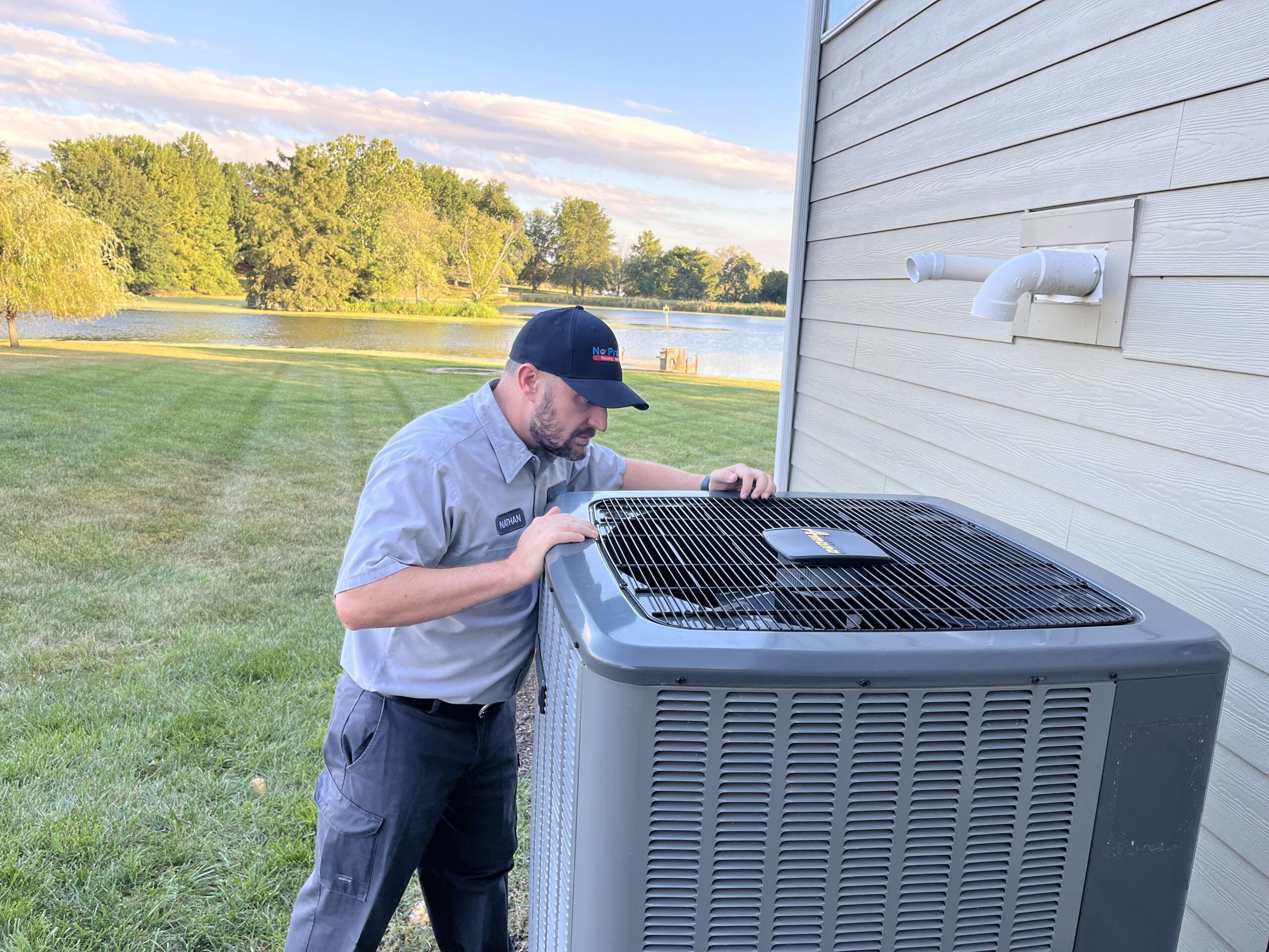 No Problem Heating & Cooling Worker performing AC Repair services in St. Peters, MO.