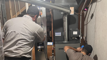 No Problem Heating & Cooling workers performing indoor air quality services in St. Peters, MO.