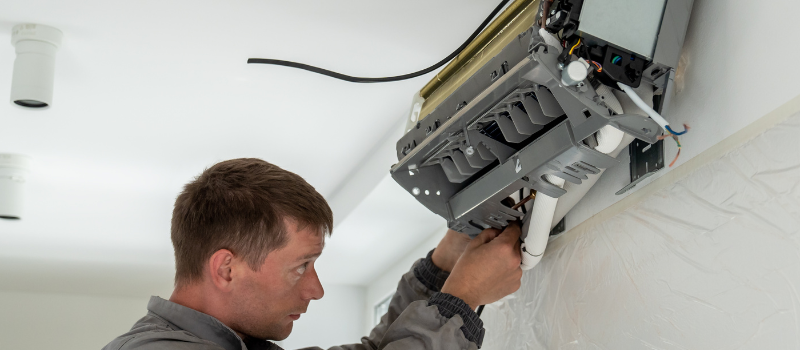 Worker providing heat pump services in St. peters, MO